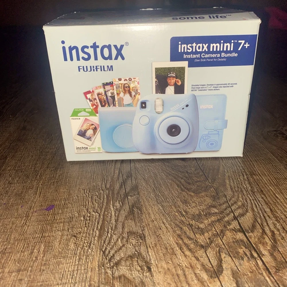 Baby Blue Polaroid Camera with photo book, film, and etc.